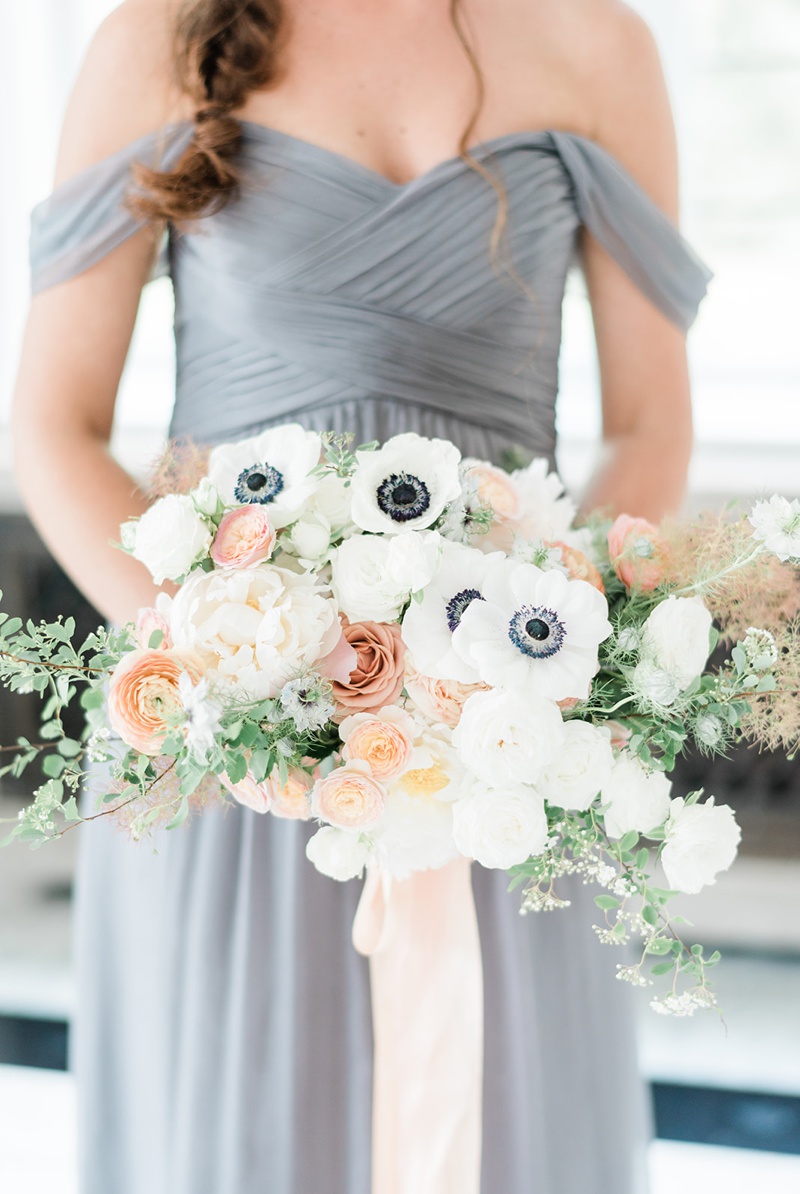 Charcoal bridesmaids dress with peach flowers and anemones
