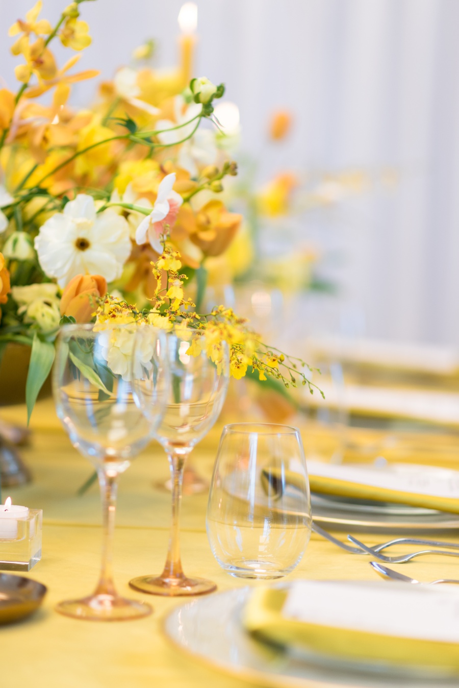 yellow table decor with blush stem wine glass