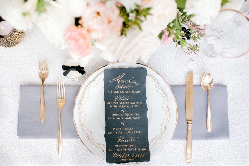 light grey, peach, and pink wedding with black menu and gold calligraphy