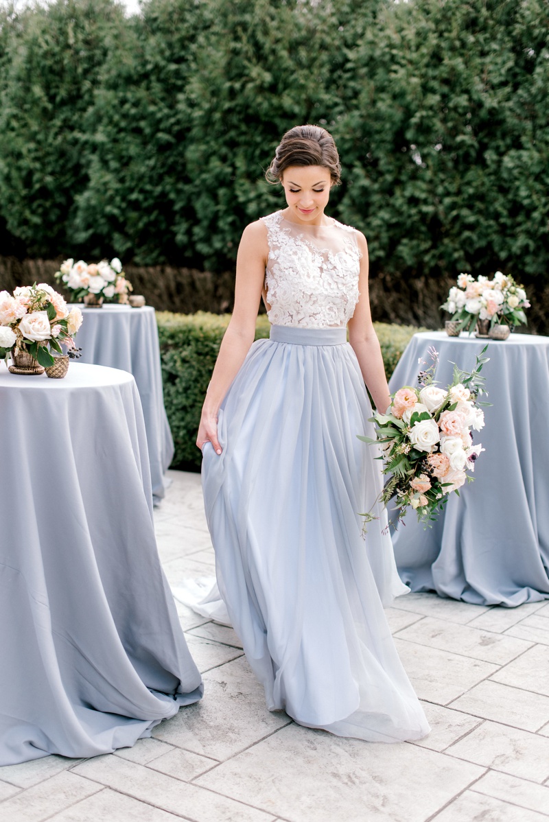 slate blue wedding with blush and peach flowers