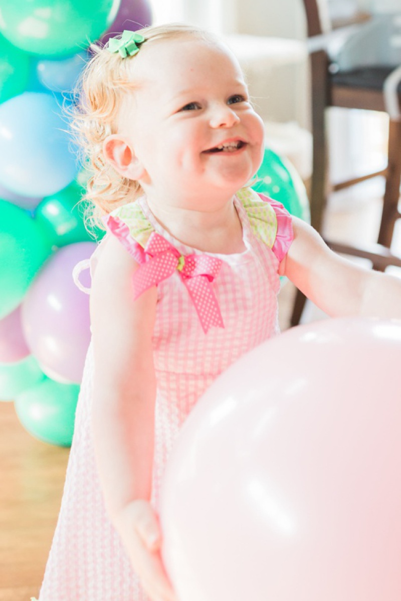 Bubble Guppies Birthday Party birthday girl with pink balloon