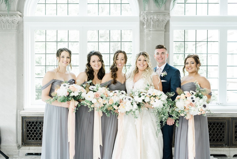 Charcoal bridesmaids dresses with peach flowers and anemones
